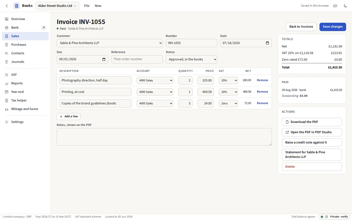 An invoice being written: the customer, its lines with their accounts and VAT codes, and the totals at each rate beside it
